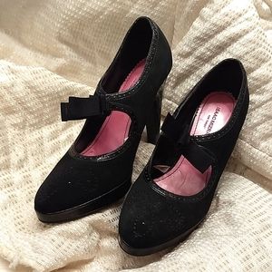 A Pair of Black Suede and Patent Heels